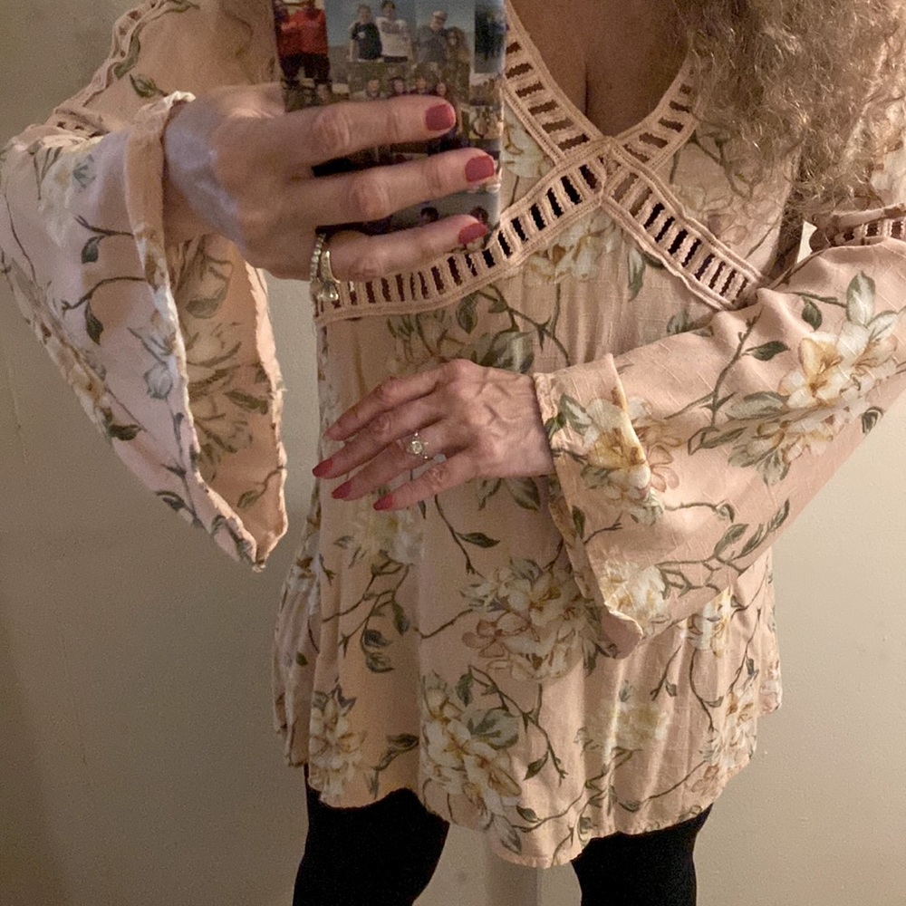 Pink floral a- line long shirt with lattice detailing.